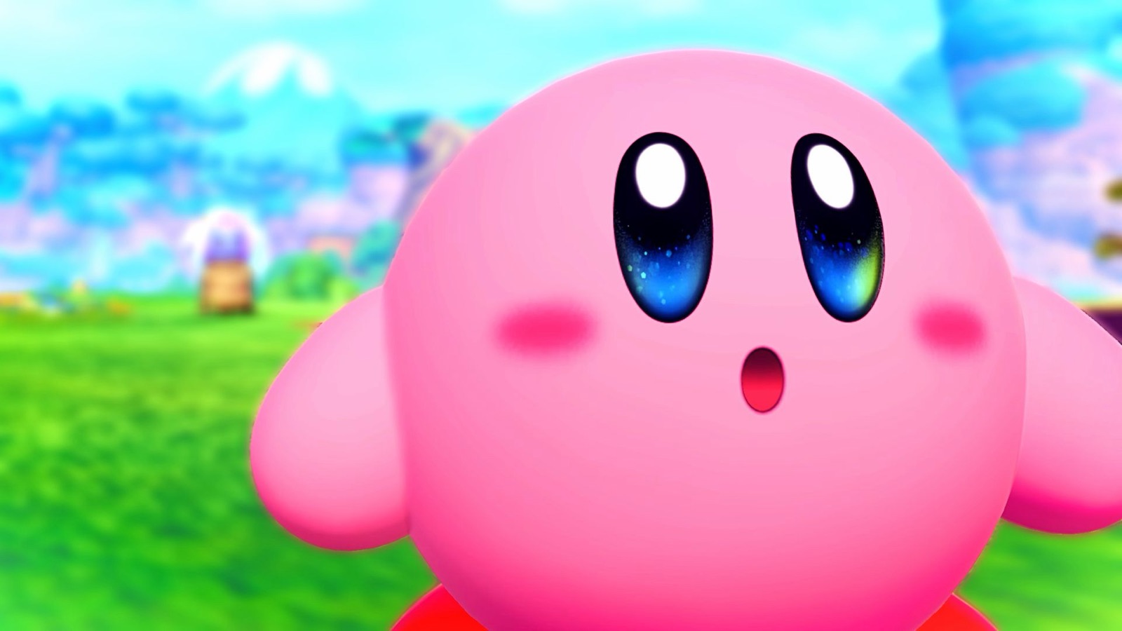 Kirby, la bolita rosa, sostiene una espada enorme sobre un prado abierto de colinas verdes que se pierde en el horizonte, con un muro agrietado al fondo por el que se cuela la luz.